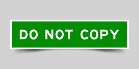 Green color square label sticker with word do not copy that inserted in gray background