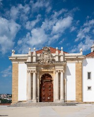 Obraz premium Facade of the University of Coimbra with a clear blue sky in Portugal