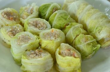 steamed Chinese cabbage stuffed chop pork and glass noodles on plate dipping sukiyaki sauce