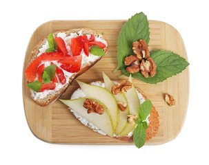 Delicious bruschettas with fresh ricotta (cream cheese), strawberry, mint and pear isolated on white, top view