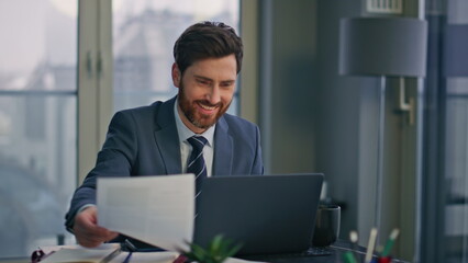 Fototapeta premium Creative startuper working laptop luxury workplace closeup. Man looking papers