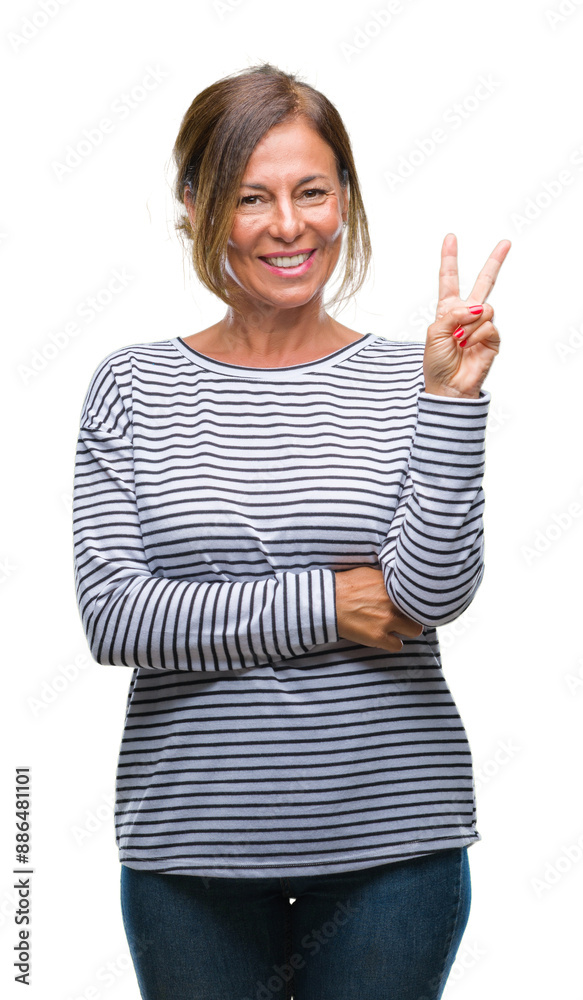 Canvas Prints middle age senior hispanic woman over isolated background smiling with happy face winking at the cam