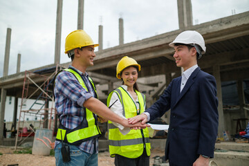 Civil engineer or construction manager with businessman shaking hands at construction site. Building,  and real estate business.
