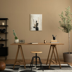 Creative composition of workplace interior with mock up poster frame, wooden desk, rattan chair, black rack, patterned rug, plant, brown wall, books and personal accessories. Home decor. Template.