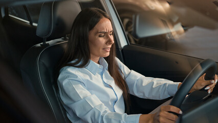 Sad upset stressed unhappy Caucasian female driver inside car in automobile woman girl lady stress...