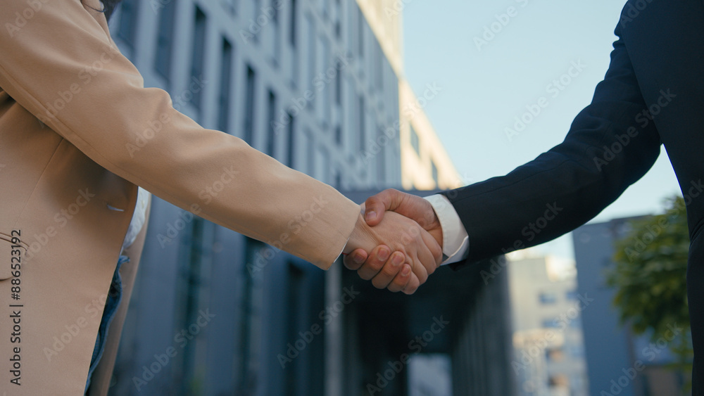 Wall mural business corporate deal unrecognizable co-workers meeting cooperation teamwork handshake in city dow