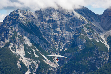 Paragliders navigate the air and thermals in the Stubai Valley in 2008, experiencing the thrill of...
