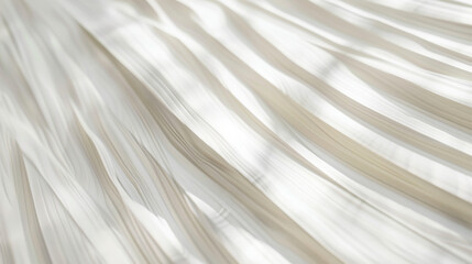 Soft pleats of fabric cascade in gentle waves, creating an elegant and soothing pattern with subtle light and shadow contrast.