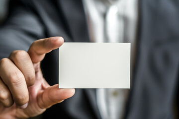 man hand holding a blank white business card for mock up