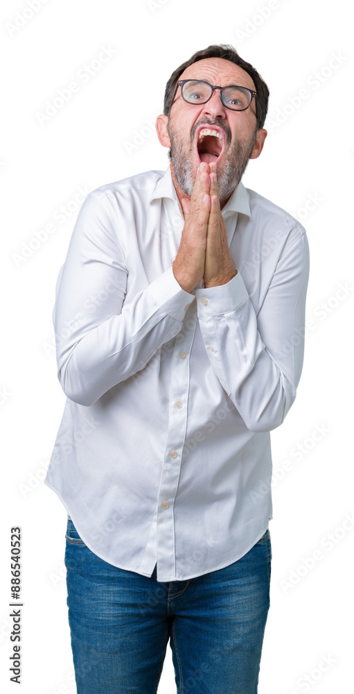 Sticker Handsome middle age elegant senior business man wearing glasses over isolated background begging and praying with hands together with hope expression on face very emotional and worried.