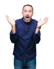 Middle age hoary senior man over isolated background clueless and confused expression with arms and...