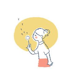 タンポポの綿毛に息を吹きかけて遊ぶ女の子