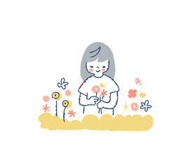 花を摘んでいる笑顔の女の子