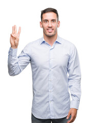 Naklejka premium Handsome young businessman showing and pointing up with fingers number three while smiling confident and happy.