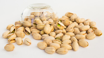 Roasted pistachios on white background