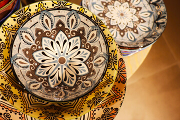 Festive ceramic tableware with Arabic pattern for festive table setting