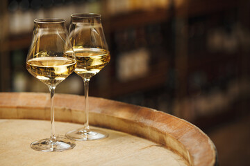 Two Glasses of White Wine on Wooden Barrel, Close up