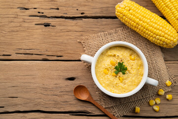 Creamy corn Pottage soup on white bowl,healthy food style.Top view