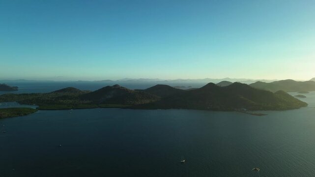 Dusk aerial over island silhouettes and calm bay near Coron Palawan Philippines