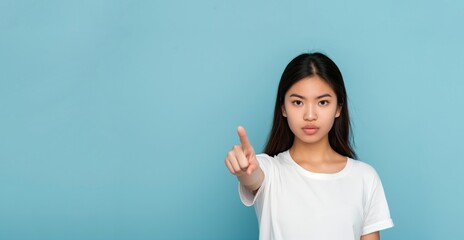Fototapeta premium Determined woman pointing forward
