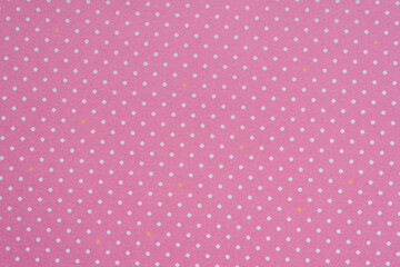 Flat paper surface of light pink polka dot pattern with white dots, textured background, high resolution photography.