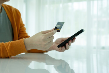 Woman online shopping with smartphone.