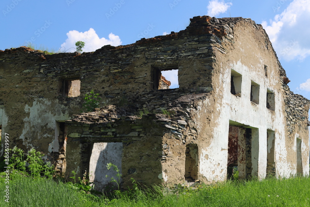 Wall mural beautiful old ruined castle in summer day.