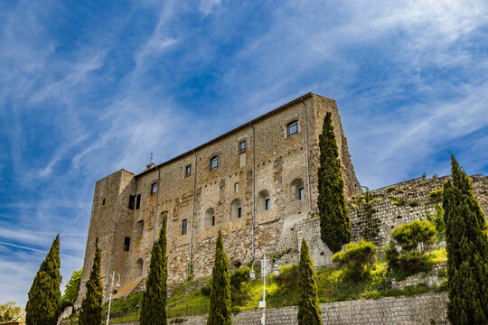 A glimpse of the ancient medieval village of Montefiascone, Viterbo, Italy. A detail of the medieval fortress of the Rocca dei Papi, which dominates the city. The imposing stone and brick building.