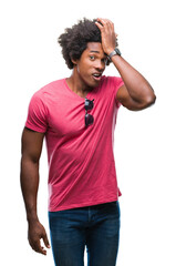 Afro american man over isolated background surprised with hand on head for mistake, remember error. Forgot, bad memory concept.