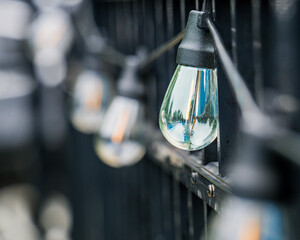 A light bulb is lit up in a dark room