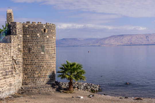 The old city of Tiberias, the wall and tower, on the coast of Sea of Galilee, with the confl
