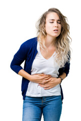 Fototapeta premium Beautiful young blonde woman over isolated background with hand on stomach because indigestion, painful illness feeling unwell. Ache concept.
