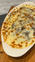 Mushrooms mozaru, signature dish. The perfect blend of rice with various katsu toppings covered with melted mozarella cheese and sauce.