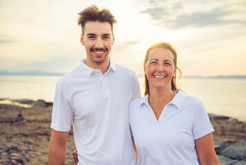 Obraz premium family at beach on summer time, mother and son having fun