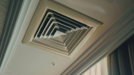 Obraz premium Modern Ceiling Air Vent in a Spacious Hotel Room with Elegant Decor