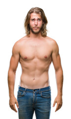Young handsome shirtless man with long hair showing sexy body over isolated background depressed and worry for distress, crying angry and afraid. Sad expression.