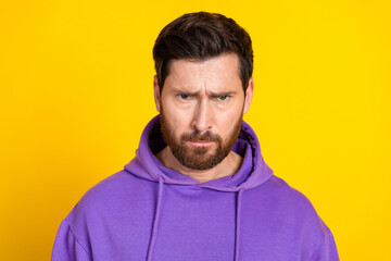 Portrait of upset sad gloomy unhappy man with bristle dressed purple hoodie angry looking at you...