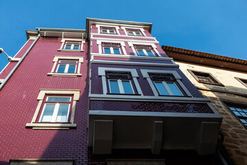 Facade of an old classic red building, Oporto, Portugal