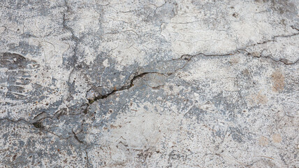 Close up image of cracked concrete surface texture, perfect for design background. Cracked Concrete Wall Texture Material
