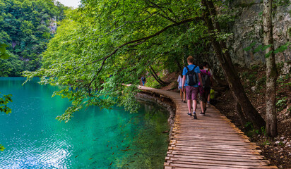  Tourist walking trail along a lake rich in fish. Plitvice lakes, Croatia © a_mikhail