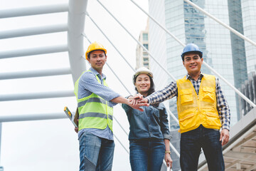 Group of multiracial people Teamwork meeting join hands Engineer Manager Foreman fist bump together. Close up diversity engineer people hands partner teams. Business connection team join partnership