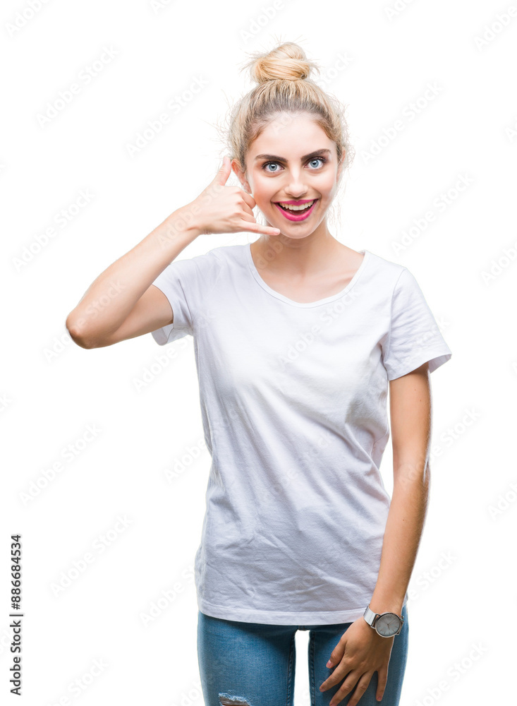 Canvas Prints Young beautiful blonde woman wearing white t-shirt over isolated background smiling doing phone gesture with hand and fingers like talking on the telephone. Communicating concepts.