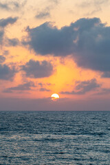 Fototapeta premium Sunset over the Mediterranean Sea at Caesarea National Park in Israel. 