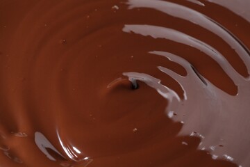 Tasty melted chocolate as background, closeup view