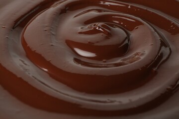 Tasty melted chocolate as background, closeup view