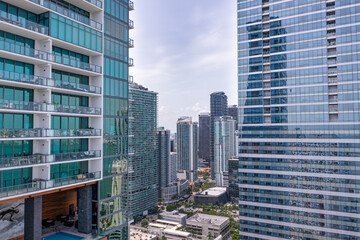 Downtown Miami framed aerial view in between condos and office buildings.