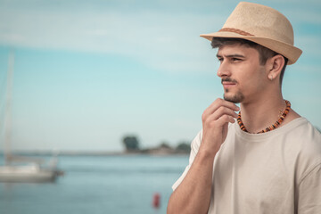 Fototapeta premium thoughtful young man looking at the sea