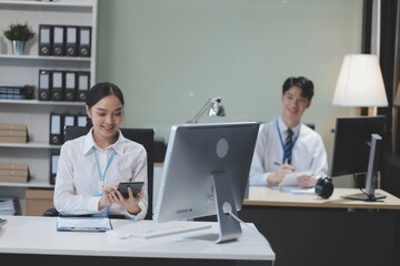 Modern Office Businessman Working on Computer. Portrait of Successful Latin IT Software Engineer Working on a Laptop at his Desk. Diverse Workplace with Professionals. Front View Shot