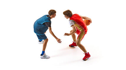 Two basketball players in action, one wearing blue jersey and other in red, as they prepare for one-on-one showdown. Concept of professional sport, competition, match, team games. Ad