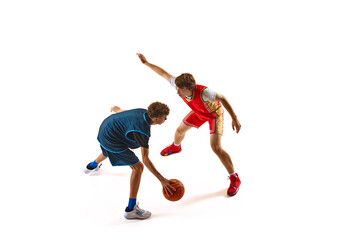Player in red jersey challenges defender in blue, each showcasing their skills in head-to-head confrontation against white studio background. Concept of sport, competition, match, team games. Ad